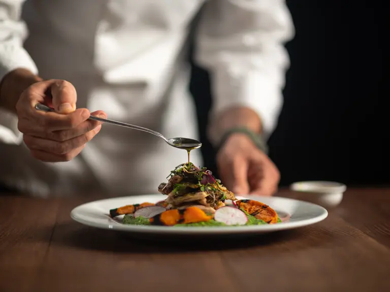 Chef With On Plate Of Food