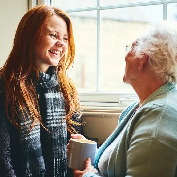 Young Girl Talking To Older Lady